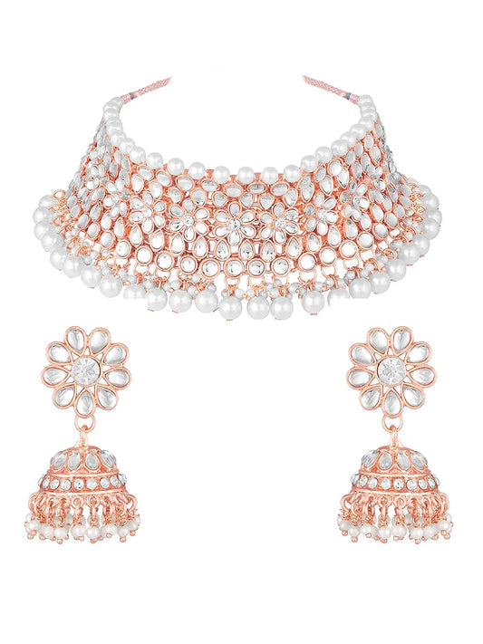 Radiance Faux Kundan Choker Set. Rose gold choker necklace set with white pearls and kundan, paired with matching floral jhumka earrings.