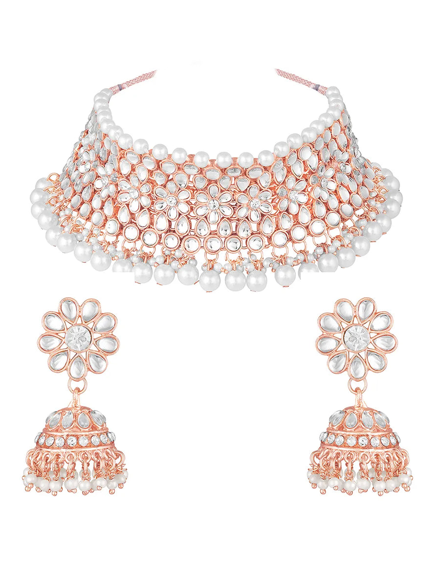 Radiance Faux Kundan Choker Set. Rose gold choker necklace set with white pearls and kundan, paired with matching floral jhumka earrings.