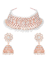 Radiance Faux Kundan Choker Set. Rose gold choker necklace set with white pearls and kundan, paired with matching floral jhumka earrings.