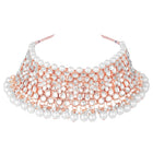 Radiance Faux Kundan Choker Set. Rose gold choker necklace set with white pearls and kundan, paired with matching floral jhumka earrings.