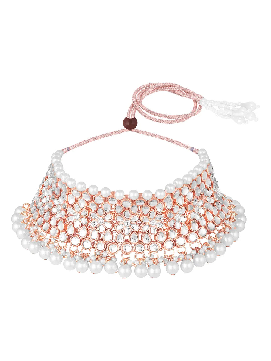 Radiance Faux Kundan Choker Set. Rose gold choker necklace set with white pearls and kundan, paired with matching floral jhumka earrings.