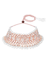 Radiance Faux Kundan Choker Set. Rose gold choker necklace set with white pearls and kundan, paired with matching floral jhumka earrings.