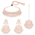 Marvel Kundan Pearls Choker Set. Rose gold choker necklace set with pearls and kundan, paired with matching earrings and maang tikka.
