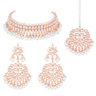 Marvel Kundan Pearls Choker Set. Rose gold choker necklace set with pearls and kundan, paired with matching earrings and maang tikka.