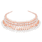 Marvel Kundan Pearls Choker Set. Rose gold choker necklace set with pearls and kundan, paired with matching earrings and maang tikka.