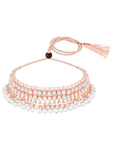 Marvel Kundan Pearls Choker Set. Rose gold choker necklace set with pearls and kundan, paired with matching earrings and maang tikka.