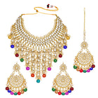 Bridal Bliss Kundan Pearl Necklace Set. Gold-plated Kundan bridal necklace set with colorful beads, matching jhumka earrings, and maang tikka. Perfect for weddings and festive occasions.