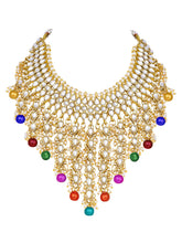 Bridal Bliss Kundan Pearl Necklace Set. Gold-plated Kundan bridal necklace set with colorful beads, matching jhumka earrings, and maang tikka. Perfect for weddings and festive occasions.