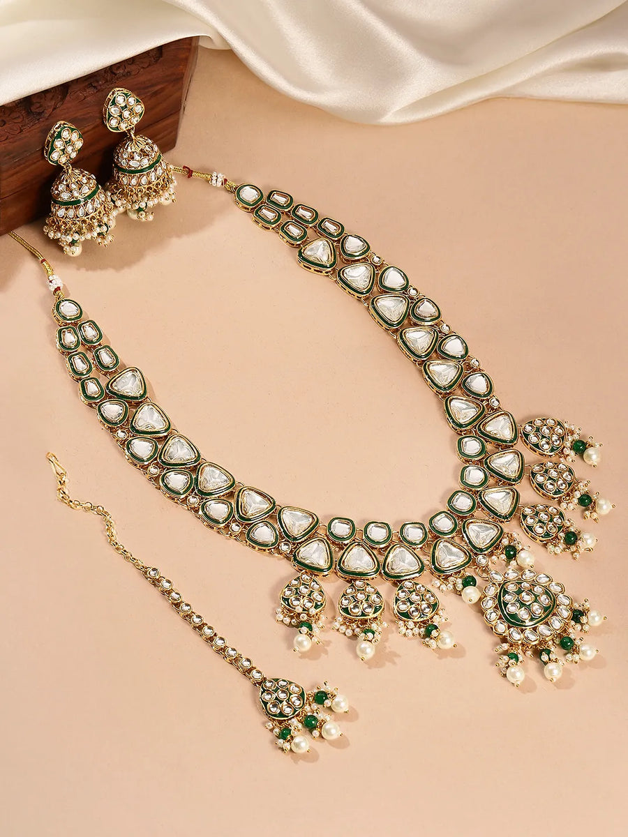 Bridal Bliss Kundan Pearl Adorn. Gold and green Kundan bridal necklace set with pearls, matching earrings, and maang tikka. Perfect for weddings and festive wear.