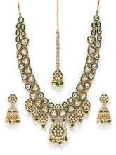 Bridal Bliss Kundan Pearl Adorn. Gold and green Kundan bridal necklace set with pearls, matching earrings, and maang tikka. Perfect for weddings and festive wear.