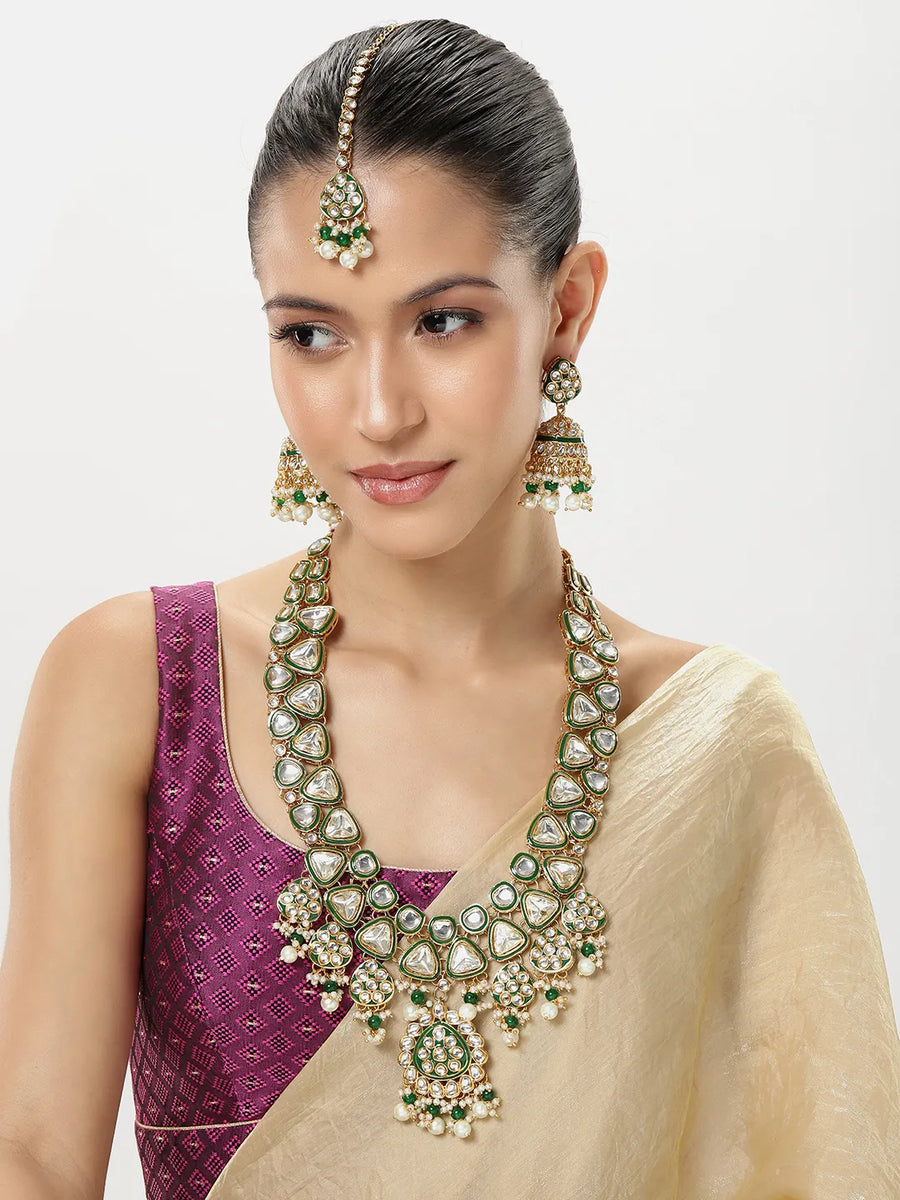Bridal Bliss Kundan Pearl Adorn. Gold and green Kundan bridal necklace set with pearls, matching earrings, and maang tikka. Perfect for weddings and festive wear.