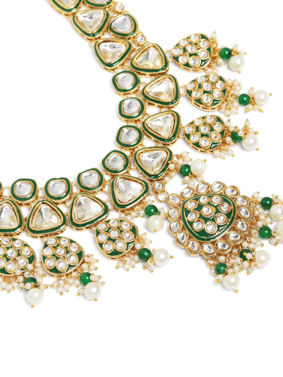Bridal Bliss Kundan Pearl Adorn. Gold and green Kundan bridal necklace set with pearls, matching earrings, and maang tikka. Perfect for weddings and festive wear.