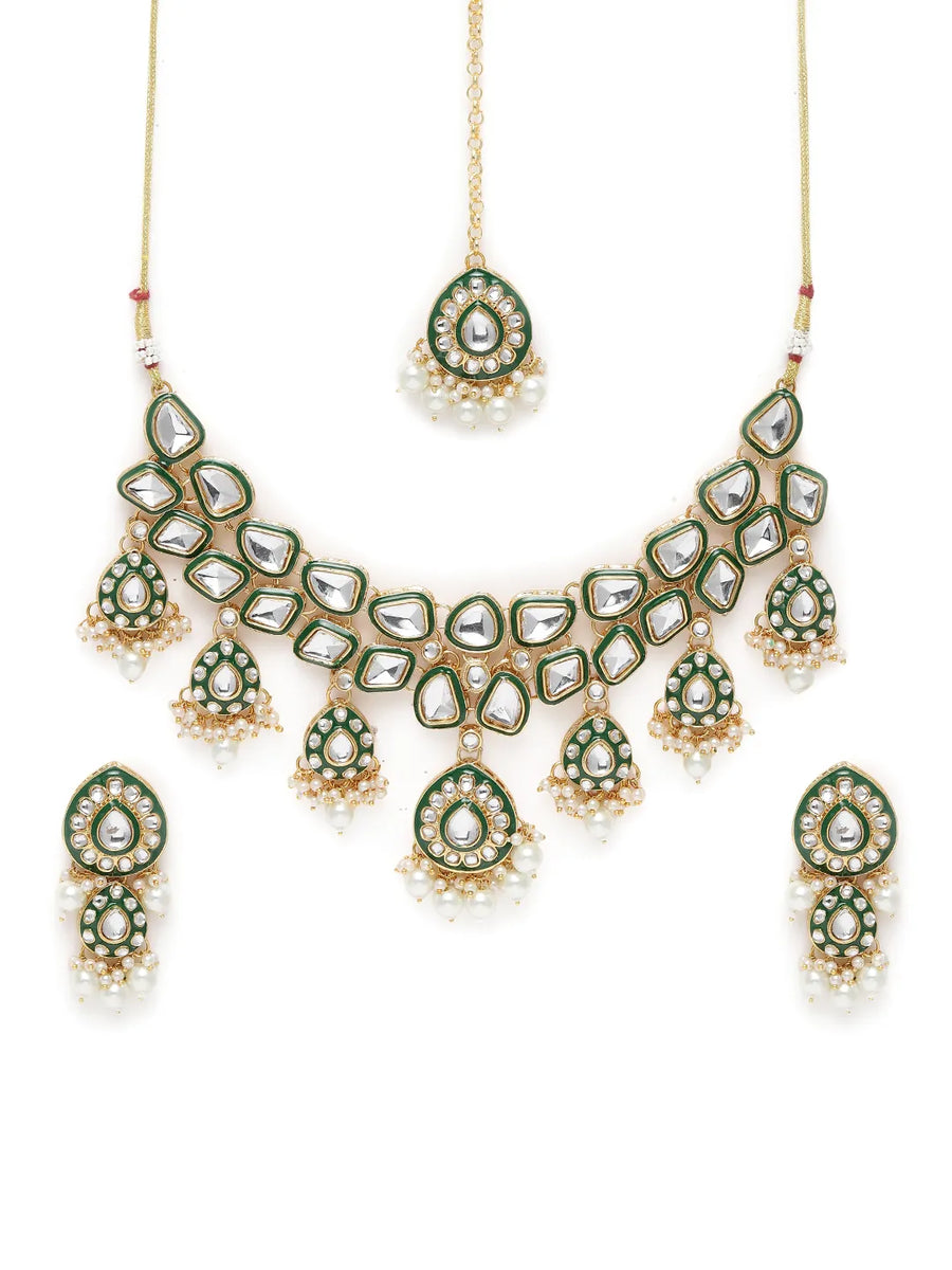 Pearled Petals Kundan Wedding Set. Gold and green Kundan necklace set with pearls, matching earrings, and maang tikka ideal for festive and traditional wear.