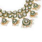 Pearled Petals Kundan Wedding Set. Gold and green Kundan necklace set with pearls, matching earrings, and maang tikka ideal for festive and traditional wear.