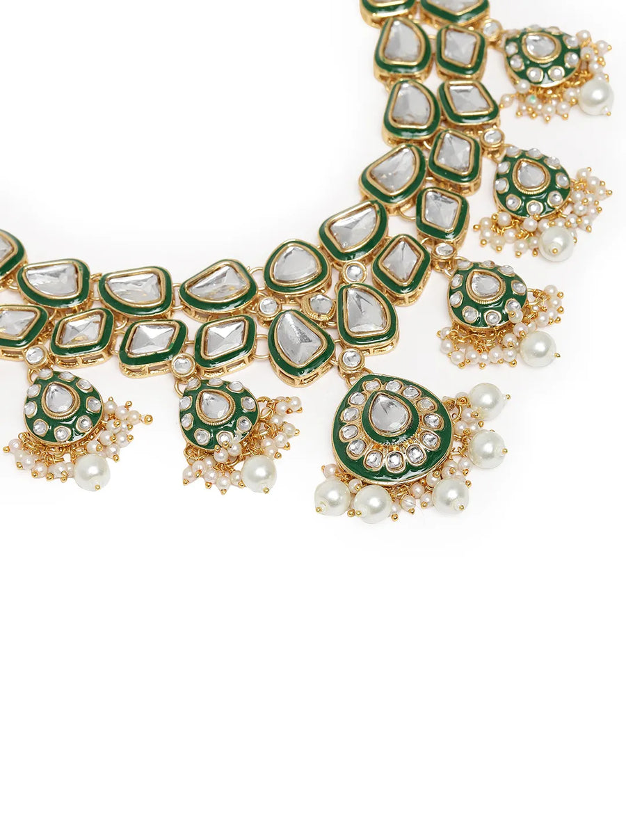 Pearled Petals Kundan Wedding Set. Gold and green Kundan necklace set with pearls, matching earrings, and maang tikka ideal for festive and traditional wear.