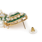 Pearled Petals Kundan Wedding Set. Gold and green Kundan necklace set with pearls, matching earrings, and maang tikka ideal for festive and traditional wear.