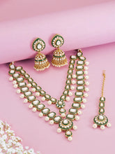 Kundan Majesty Double Layer Set. Gold and green double-layer Kundan necklace set with pearls, matching jhumka earrings, and maang tikka – perfect for festive and traditional wear.