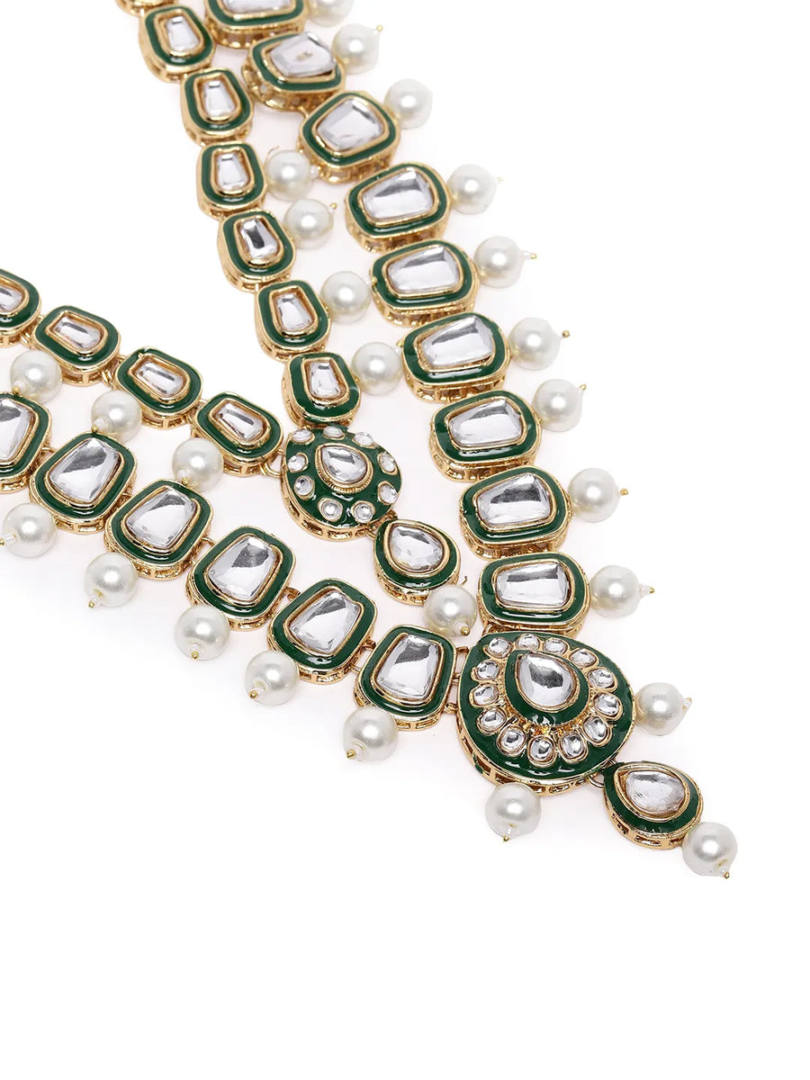 Kundan Majesty Double Layer Set. Gold and green double-layer Kundan necklace set with pearls, matching jhumka earrings, and maang tikka – perfect for festive and traditional wear.
