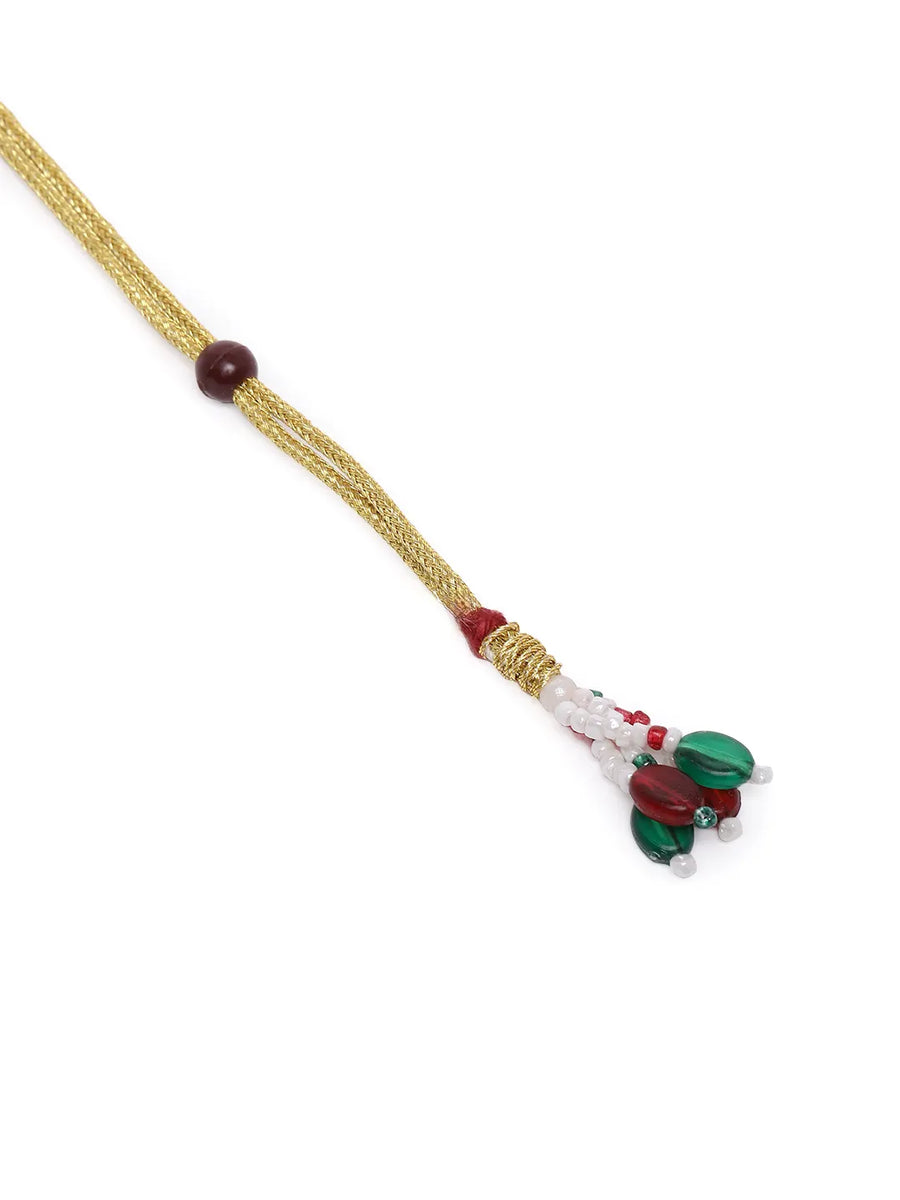 Kundan Majesty Double Layer Set. Gold and green double-layer Kundan necklace set with pearls, matching jhumka earrings, and maang tikka – perfect for festive and traditional wear.