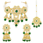 Floral Cascade Faux Kundan Set. Gold and green choker necklace set with Kundan, green beads, and white pearls, paired with matching earrings and maang tikka perfect for festive and ethnic wear.