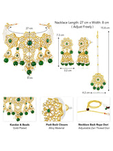 Floral Cascade Faux Kundan Set. Gold and green choker necklace set with Kundan, green beads, and white pearls, paired with matching earrings and maang tikka perfect for festive and ethnic wear.