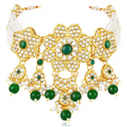 Floral Cascade Faux Kundan Set. Gold and green choker necklace set with Kundan, green beads, and white pearls, paired with matching earrings and maang tikka perfect for festive and ethnic wear.