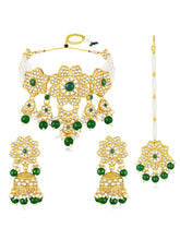 Floral Cascade Faux Kundan Set. Gold and green choker necklace set with Kundan, green beads, and white pearls, paired with matching earrings and maang tikka perfect for festive and ethnic wear.