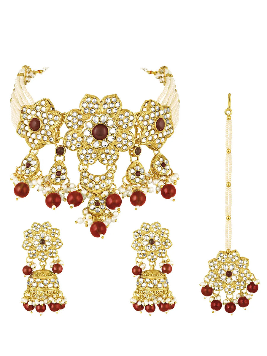 Floral Cascade Faux Kundan Set. Gold and maroon choker necklace set with Kundan, maroon beads, and white pearls, paired with matching earrings and maang tikka perfect for festive and ethnic wear.