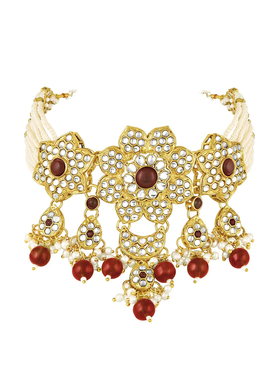 Floral Cascade Faux Kundan Set. Gold and maroon choker necklace set with Kundan, maroon beads, and white pearls, paired with matching earrings and maang tikka perfect for festive and ethnic wear.