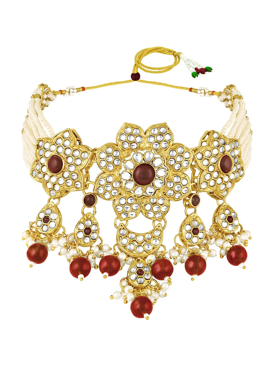 Floral Cascade Faux Kundan Set. Gold and maroon choker necklace set with Kundan, maroon beads, and white pearls, paired with matching earrings and maang tikka perfect for festive and ethnic wear.