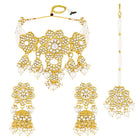 Floral Cascade Faux Kundan Set. Gold and white choker necklace set with Kundan, white beads, and white pearls, paired with matching earrings and maang tikka perfect for festive and ethnic wear.