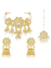 Floral Cascade Faux Kundan Set. Gold and white choker necklace set with Kundan, white beads, and white pearls, paired with matching earrings and maang tikka perfect for festive and ethnic wear.