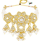 Floral Cascade Faux Kundan Set. Gold and white choker necklace set with Kundan, white beads, and white pearls, paired with matching earrings and maang tikka perfect for festive and ethnic wear.