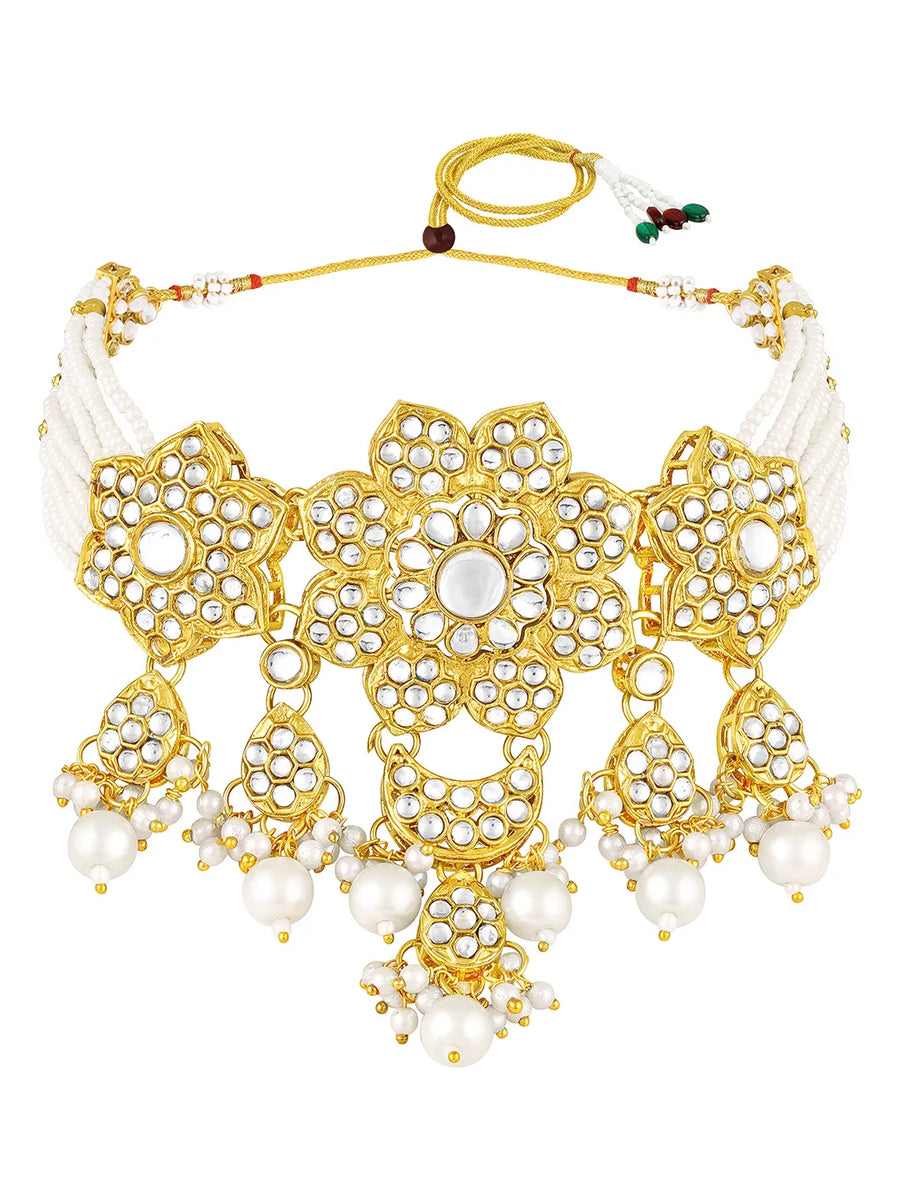 Floral Cascade Faux Kundan Set. Gold and white choker necklace set with Kundan, white beads, and white pearls, paired with matching earrings and maang tikka perfect for festive and ethnic wear.
