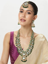 Nature's Glisten Green Necklace Set by Peora. Gold-plated green Kundan necklace set with matching earrings and maang tikka, featuring green beads & white pearls.