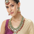 Nature's Glisten Green Necklace Set by Peora. Gold-plated red & Green Kundan necklace set with matching earrings and maang tikka, featuring red beads & white pearls.