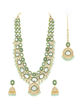 Glistening Nature Necklace Set by Peora. Gold-plated green Kundan necklace set with matching earrings and maang tikka, featuring mint green beads.
