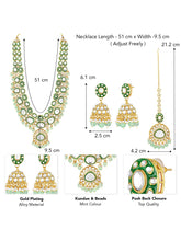 Glistening Nature Necklace Set by Peora. Gold-plated green Kundan necklace set with matching earrings and maang tikka, featuring mint green beads.