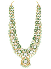 Glistening Nature Necklace Set by Peora. Gold-plated green Kundan necklace set with matching earrings and maang tikka, featuring mint green beads.