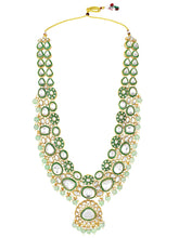 Glistening Nature Necklace Set by Peora. Gold-plated green Kundan necklace set with matching earrings and maang tikka, featuring mint green beads.