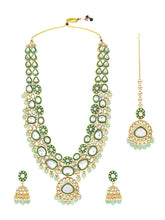 Glistening Nature Necklace Set by Peora. Gold-plated green Kundan necklace set with matching earrings and maang tikka, featuring mint green beads.