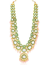 Glistening Nature Necklace Set by Glistening Nature Necklace Set by Peora. Gold-plated pink Kundan necklace set with matching earrings and maang tikka, featuring soft pink beads.