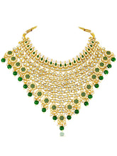 Royal Beads & Kundan Bridal Set. Gold jewellery set, pair of earrings & maangtikka embellished with with Kundan, green stones along with pearls. Prefect for your wedding day by peora.