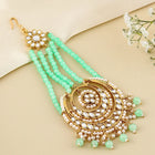 Regal Kundan Studded Paso Jewellery. Paso with gold and mint green beads & studded with kundan. Best for your wedding look.