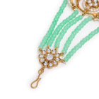Regal Kundan Studded Paso Jewellery. Paso with gold and mint green beads & studded with kundan. Best for your wedding look.