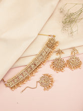 Royal Heritage Pearl Choker Set. Gold kundan & pearl jewellery set with maangtikka and earrings. Best selling & Prefect for your wedding, bridal & special occasion looks.