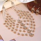 Kundan Cascade in Pearled Glory. Delicate necklace with floral designs. Best for a royal & regal looks. Make your occasion & wedding special with Peora.