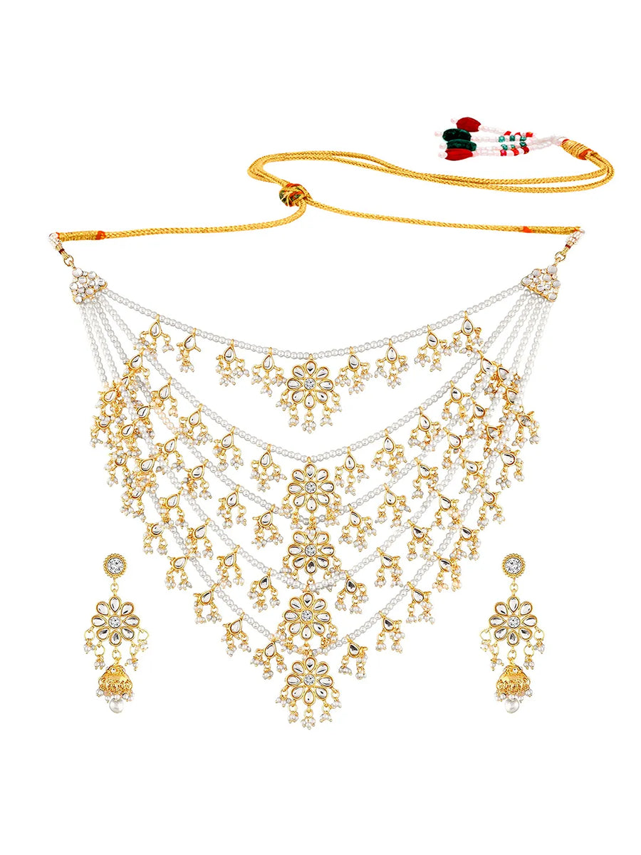 Kundan Cascade in Pearled Glory. Delicate necklace with floral designs. Best for a royal & regal looks. Make your occasion & wedding special with Peora.