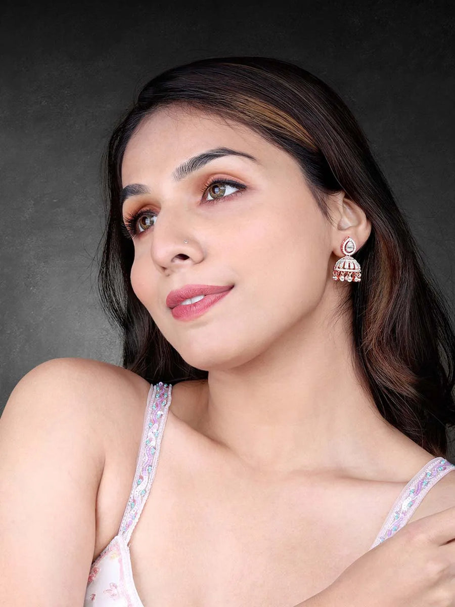 Luxurious Elegance CZ Jhumki Earrings. A pair of rose gold-colored CZ jhumki earrings with intricate designs and teardrop-shaped stones.