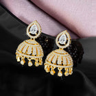 Luxurious Elegance CZ Jhumki Earrings. A pair of gold-colored CZ jhumki earrings with intricate designs and teardrop-shaped stones.